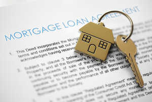 Mortgage application with house shaped keyring