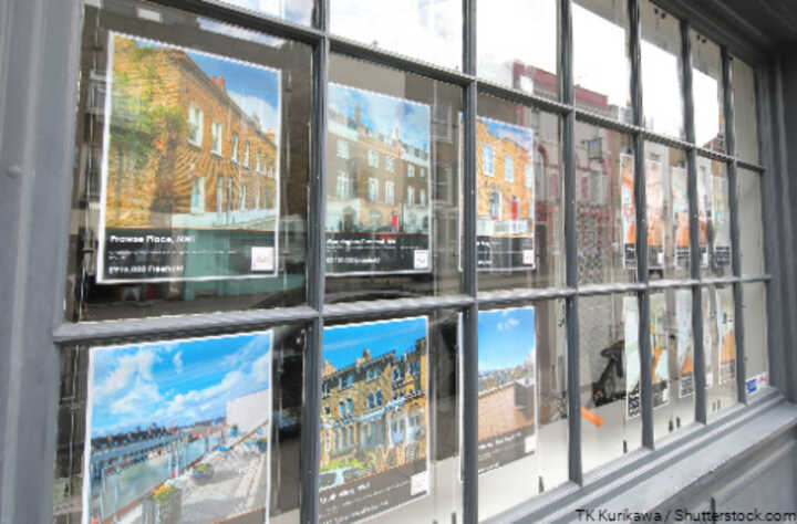 Property listings in an estate agent's window