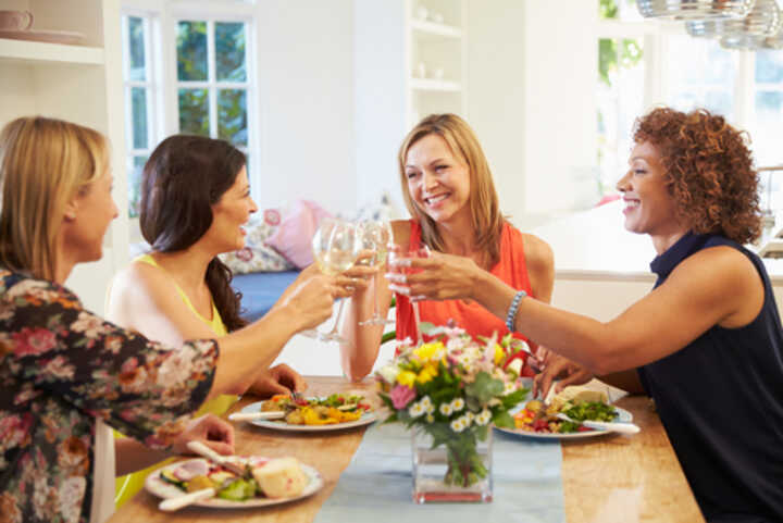 Group of mature female friends enjoying lunch together