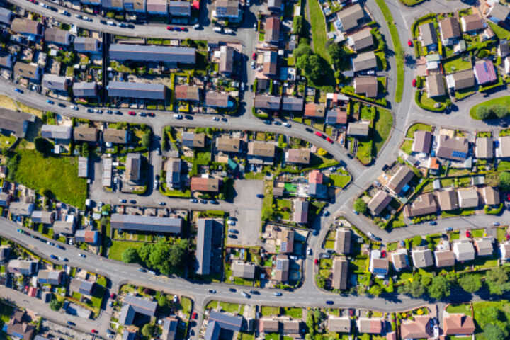 Aerial view of semi-detached and terrace homes on winding streets